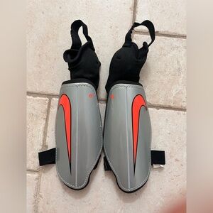 3/25$ NIKE Kid Soccer Gray and Red Shin Guards
